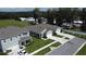 An aerial shot of new homes with a green lawn and well-maintained landscaping at 30376 Armenia Rd, Leesburg, FL 34748