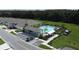 Aerial view of a community pool area with lounge chairs and palm trees at 30376 Armenia Rd, Leesburg, FL 34748