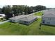 Aerial view of gray homes with green lawns and fences at 30376 Armenia Rd, Leesburg, FL 34748