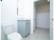 A bathroom with a single sink vanity and tile flooring at 30376 Armenia Rd, Leesburg, FL 34748