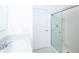Bathroom features a sink, shower with glass door, and white door at 30376 Armenia Rd, Leesburg, FL 34748