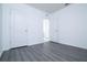 Bedroom featuring gray wood-look flooring at 30376 Armenia Rd, Leesburg, FL 34748