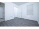 A sunlit bedroom featuring luxury vinyl plank flooring and ample natural light at 30376 Armenia Rd, Leesburg, FL 34748