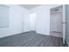 Bedroom features gray wood-look flooring at 30376 Armenia Rd, Leesburg, FL 34748