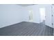 Bedroom showcasing neutral walls and flooring, with two doors leading to an attached bathroom and closet at 30376 Armenia Rd, Leesburg, FL 34748