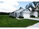 This is a beautifully landscaped home featuring a well-maintained lawn with a charming exterior at 30376 Armenia Rd, Leesburg, FL 34748