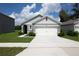 Charming single-story home with a two-car garage and manicured landscaping at 30376 Armenia Rd, Leesburg, FL 34748