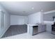 The kitchen has stainless steel appliances, gray cabinetry, a stone countertop and lots of room at 30376 Armenia Rd, Leesburg, FL 34748