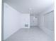 Bright, airy living room with white walls and tile flooring at 30376 Armenia Rd, Leesburg, FL 34748
