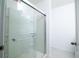 Bright bathroom shower features glass doors and chrome hardware at 30376 Armenia Rd, Leesburg, FL 34748