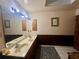 Spacious primary bathroom with double sink vanity, mirror, and a neutral color palette at 3725 Blossom St, Kissimmee, FL 34746