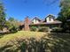 Charming two-story brick home with dormer windows and mature landscaping at 3725 Blossom St, Kissimmee, FL 34746