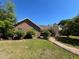 Well-maintained brick home with lush greenery and a brick walkway at 3725 Blossom St, Kissimmee, FL 34746