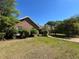 Well-maintained brick home with lush greenery and a brick walkway at 3725 Blossom St, Kissimmee, FL 34746