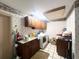 Spacious laundry area, featuring a utility sink, cabinets, and modern washing machine for convenience at 3725 Blossom St, Kissimmee, FL 34746