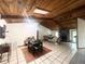 Open living space with wood ceilings, skylights, and tile flooring at 3725 Blossom St, Kissimmee, FL 34746