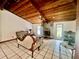 Spacious living room featuring a wood ceiling, fireplace, and tile flooring at 3725 Blossom St, Kissimmee, FL 34746
