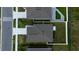 Birds-eye view of the house showcasing the roof, landscaping, and proximity to neighboring homes at 381 Singing Sands Cir, Lake Wales, FL 33859