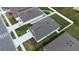 Aerial view of the house displaying its backyard space and the layout of the community at 381 Singing Sands Cir, Lake Wales, FL 33859