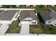 Overhead shot of the property with a well-manicured lawn and a clear view of the neighborhood at 381 Singing Sands Cir, Lake Wales, FL 33859