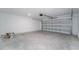 Open garage with automatic door at 381 Singing Sands Cir, Lake Wales, FL 33859