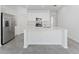 Contemporary kitchen with stainless steel appliances, quartz countertops, and large center island at 381 Singing Sands Cir, Lake Wales, FL 33859