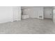 Spacious open-concept living room with tile floors, perfect for entertaining at 381 Singing Sands Cir, Lake Wales, FL 33859