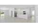 Open-concept living and kitchen area with stainless steel appliances and ample natural light at 381 Singing Sands Cir, Lake Wales, FL 33859