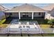 Inviting backyard patio featuring a well-manicured lawn and a charming white picket fence for privacy at 3848 Cabo Rojo Dr, St Cloud, FL 34772