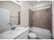 Bathroom with white cabinets, quartz countertop, tub, and tiled shower at 3848 Cabo Rojo Dr, St Cloud, FL 34772