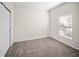 Neutral bedroom with carpet, closet, and window providing natural light at 3848 Cabo Rojo Dr, St Cloud, FL 34772