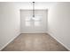 Dining room featuring neutral paint, tile flooring, and contemporary light fixture at 3848 Cabo Rojo Dr, St Cloud, FL 34772