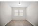 Neutral room with two windows and tile floors at 3848 Cabo Rojo Dr, St Cloud, FL 34772