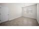 Neutral room with two windows, door and tile floors at 3848 Cabo Rojo Dr, St Cloud, FL 34772