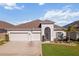 Charming single-story home featuring a two-car garage and a well-maintained lawn with beautiful landscaping at 3848 Cabo Rojo Dr, St Cloud, FL 34772