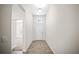 Bright and airy foyer featuring tile flooring, a front door with transom window, and a glimpse into the home at 3848 Cabo Rojo Dr, St Cloud, FL 34772