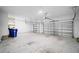 Spacious two-car garage with ample room for vehicles and storage, featuring clean and bright interiors at 3848 Cabo Rojo Dr, St Cloud, FL 34772