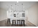 Kitchen with white cabinets, quartz countertops, and stainless steel appliances at 3848 Cabo Rojo Dr, St Cloud, FL 34772