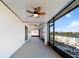 Large screened lanai with ceiling fans offers panoramic water views and leads to an inviting outdoor patio at 3848 Cabo Rojo Dr, St Cloud, FL 34772