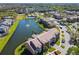 Beautiful aerial view of the community with a scenic pond, fountain, pool and well-maintained landscaping at 4105 Tropical Isle Blvd # 222, Kissimmee, FL 34741