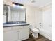 Well-lit bathroom showcasing vanity, mirror, vinyl flooring, and shower-tub combination at 4105 Tropical Isle Blvd # 222, Kissimmee, FL 34741