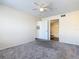 Bedroom featuring carpet flooring, a ceiling fan, and doorways to bathroom and closet at 4105 Tropical Isle Blvd # 222, Kissimmee, FL 34741