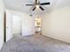 Spacious bedroom features ensuite bathroom, closet, and ceiling fan at 4105 Tropical Isle Blvd # 222, Kissimmee, FL 34741