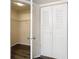 Bedroom closet with shelving seen through an open doorway and bifold doors at 4105 Tropical Isle Blvd # 222, Kissimmee, FL 34741