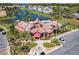 Charming clubhouse with a pool, well-manicured landscaping, and convenient parking at 4105 Tropical Isle Blvd # 222, Kissimmee, FL 34741