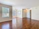 Spacious living room with hardwood floors, neutral walls, and large windows for natural light at 4105 Tropical Isle Blvd # 222, Kissimmee, FL 34741