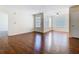 Bright living room featuring hardwood floors and ample natural light from the large windows at 4105 Tropical Isle Blvd # 222, Kissimmee, FL 34741