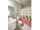 Cheerful bathroom with vanity, toilet, and Mickey Mouse themed shower curtain at 4441 Shiva Loop, Kissimmee, FL 34746