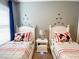 Shared bedroom with twin beds, themed bedding, and a central nightstand at 4441 Shiva Loop, Kissimmee, FL 34746