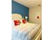 Comfortable bedroom with nautical themed pillows and decor, creating a relaxing and inviting space at 4441 Shiva Loop, Kissimmee, FL 34746